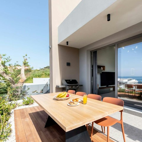 Dine alfresco on the terrace with views across the horizon