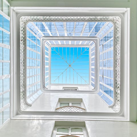 Admire the building's stunning atrium