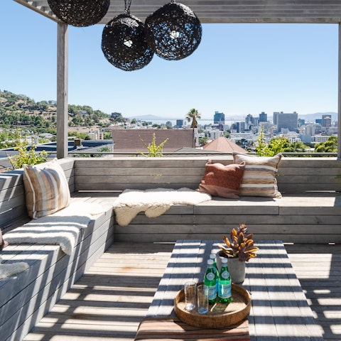 Gather for drinks on the private terrace overlooking the city