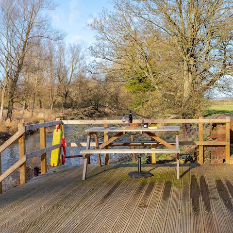Sit out on the deck above the River Turvey and savour the tranquillity