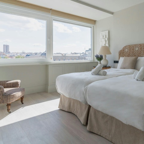 Wake up to views of the Plaza from the elegant bedroom