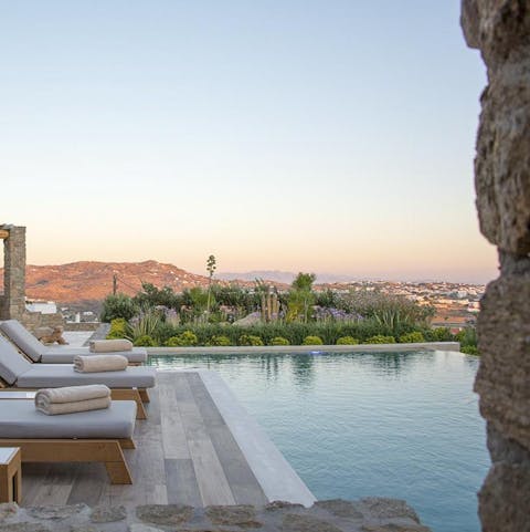 Slip into the serene swimming pool and admire the rugged landscape
