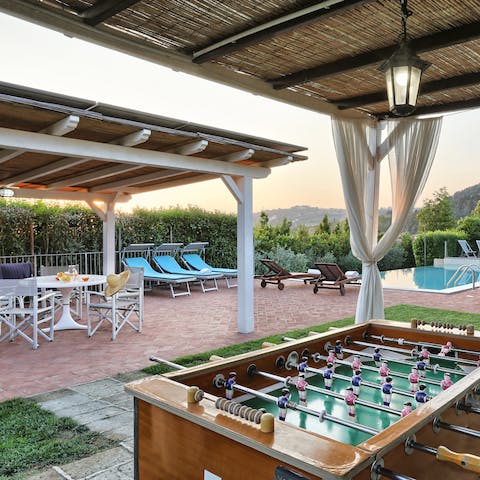 Seek some shade under one of the pergolas and play a game or two of foosball