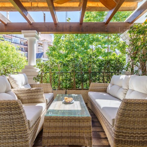 Share cocktails on the comfy sofas