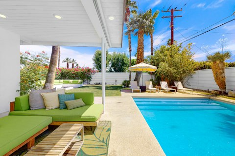 Cool off in the pool beneath swaying palms