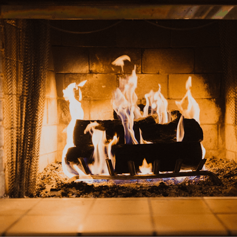 Spend rainy days curled up beside an open fireplace