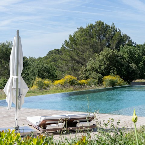 Stretch out by the pool on a sunny afternoon