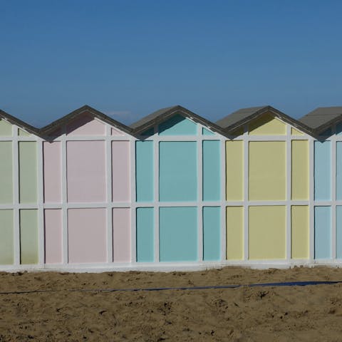 Discover the colourful local beaches of Riccione, just a short walk from your villa