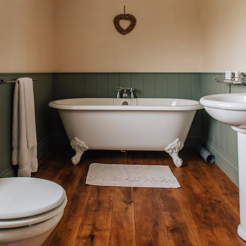 Bathe in one of the luxurious free-standing roll-top tubs