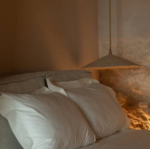 Sink into crisp linens and stone-walled serenity