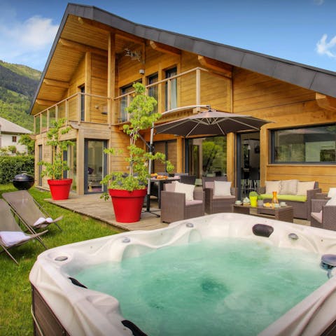 Relax in the hot tub while taking in the scenery