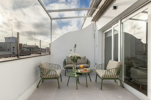 Sit out above the city with a drink in hand