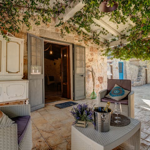 Unwind on the terrace with a glass of wine and a good book
