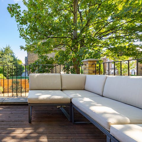 Enjoy some cocktails on the L-shaped sofa on the private terrace