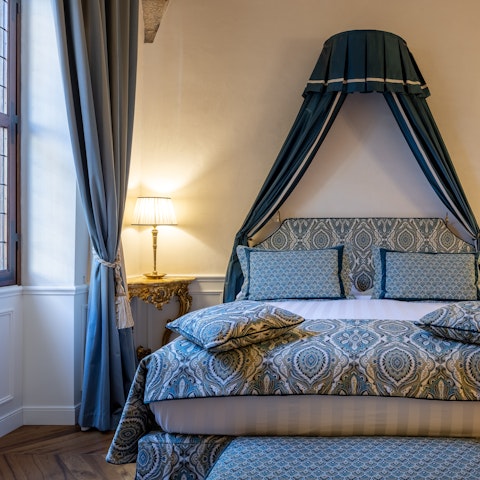 Drift off to sleep in the Reniassance-style bedroom