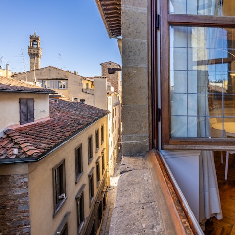 Peer out over the rooftops of central Florence