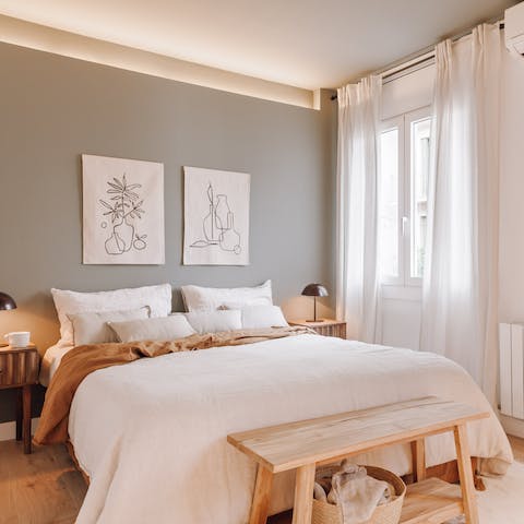 Relax in the comfortable bed after a busy day of Barcelona sightseeing