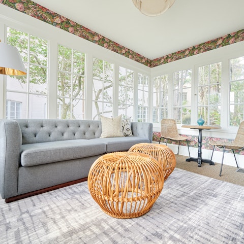 Sip a glass of wine in the bright living space at the end of a busy day