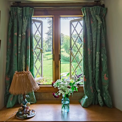 Wake up to views of the Great Tew Estate out the mullioned windows