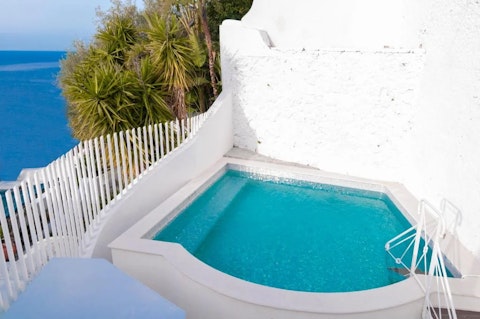 Cool off in the pool with the sea stretched out below