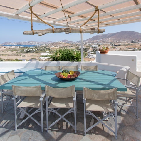 Sit down to an alfresco meal while feasting on sea and mountain views