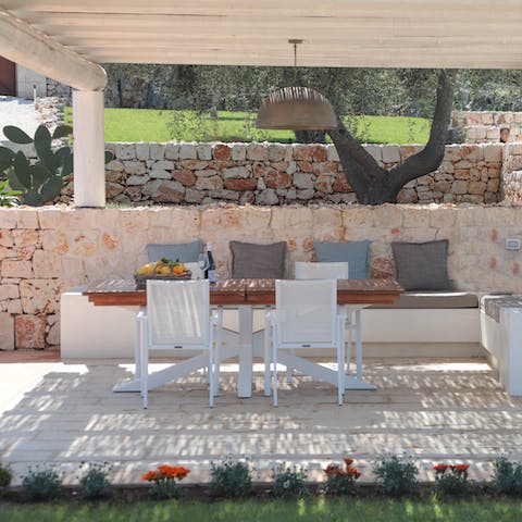 Enjoy some focaccia, mozzarella and olives at the shaded dining table