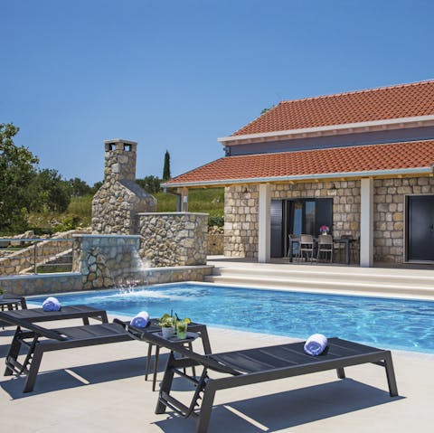 Splash about in the swimming pool on hot afternoons