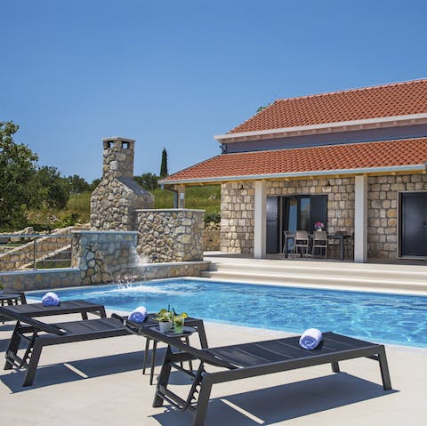 Splash about in the swimming pool on hot afternoons