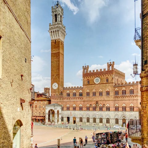 Visit the central square, Piazza del Campo, in Siena