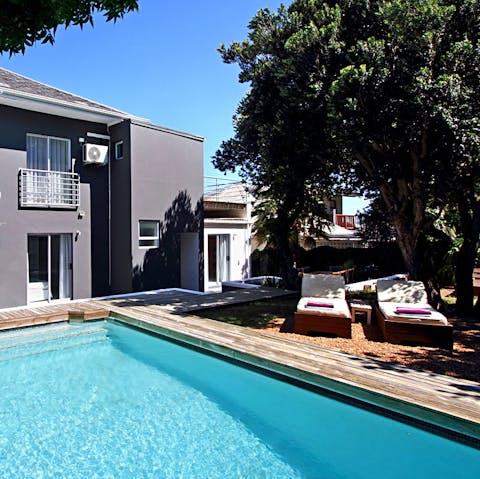 Lounge out poolside and relax on the sun-dappled patio