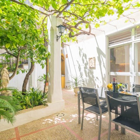 Dine al fresco under the shade of a flourishing lemon tree