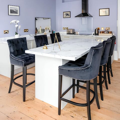 Begin your day with coffee and pastries at the chic kitchen island