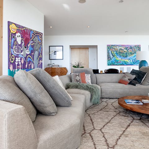 Find the comfiest spot on the huge L-shaped couch after some busy sightseeing in Hollywood