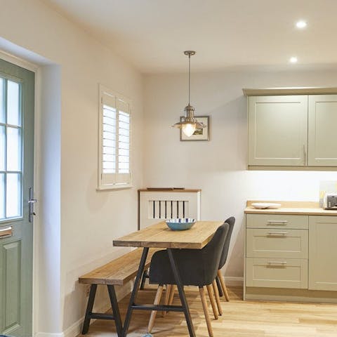 Gather at the dining table, which doubles as a workspace