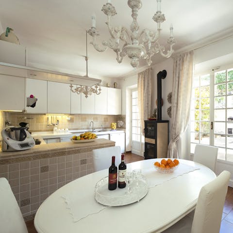 Take up cooking classes with your hosts in the charming kitchen
