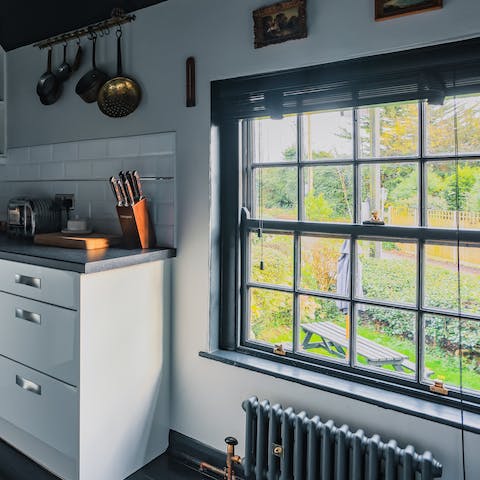 Check out views of the lush, leafy garden as you prepare dinner in the kitchen