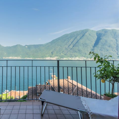 Relax on the sun lounger with views across Lake Como