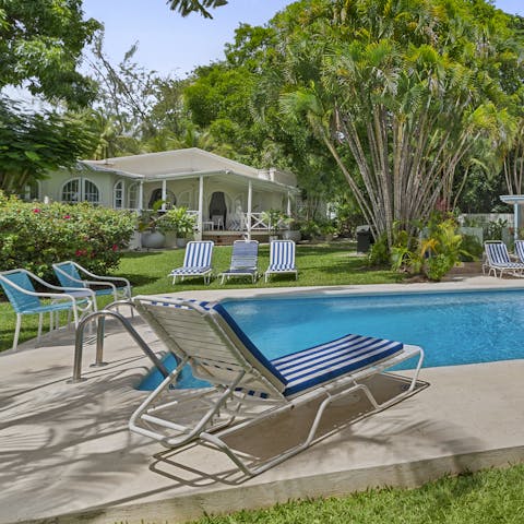 Spend the day reading by your private pool