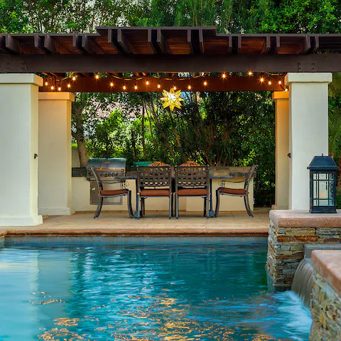 Paddle elegantly through the pool before taking a seat underneath the pergola