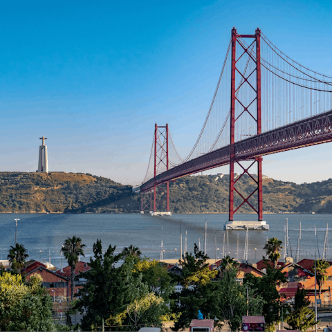 Visit the beautiful 25 de Abril Bridge, a twenty-minute walk away