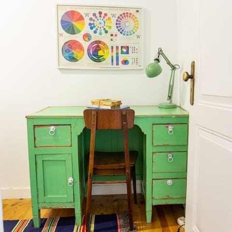 Catch up on work at the colourful desk space
