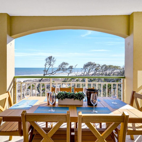 Gather on the balcony for dinner with an ocean view