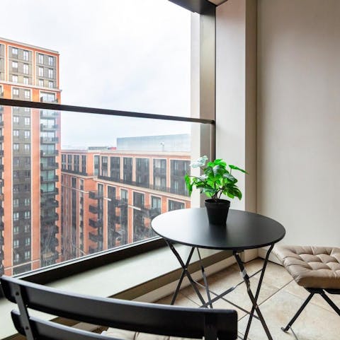 Enjoy the cityscape from the private balcony
