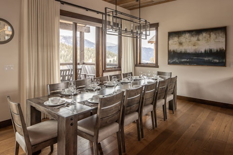 Gather around the long table with sweeping alpine views framing every seat