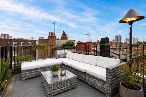 Catch the evening light across Chelsea's rooftops with a drink in hand