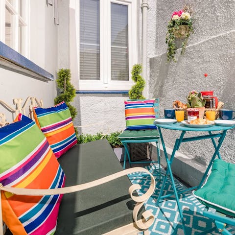 Start your day with breakfast and fresh coffee out on the courtyard terrace