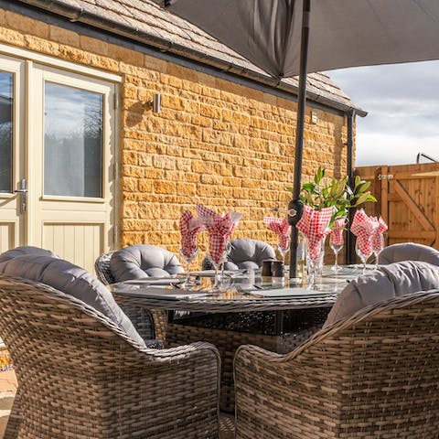 Gather for a bottle of fizz on the patio and catch the evening sun