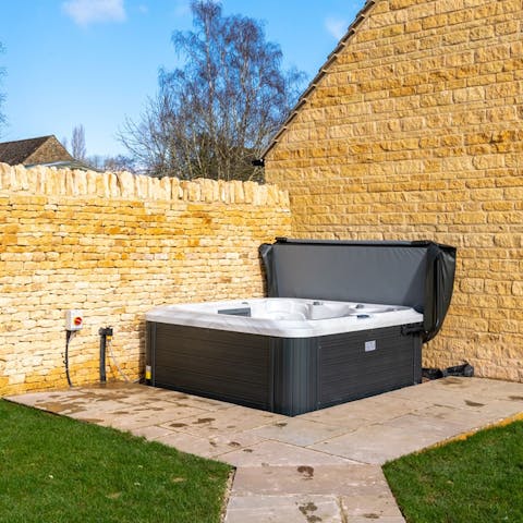 Soak sore muscles in the private hot tub after countryside rambles