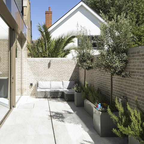 Relax in the alfresco lounge area with the sun shining on your face