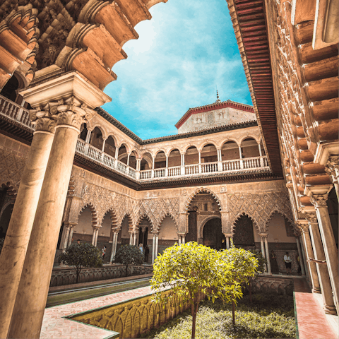 Pay a visit to the impressive Alcázar of Seville, only ten minutes' walk away